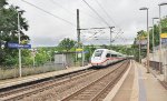 ICE (Inter-City Express) train southbound through Melsungen's Bartenwetzer Bruecke station